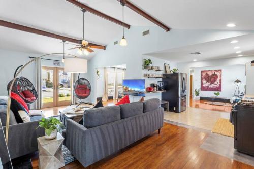 a living room with two couches and a tv at AC Beach Farmhouse Retreat - 5BD 2BA in Atlantic City