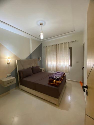 a bedroom with a large bed in a room at مولاي يعقوب in Fès