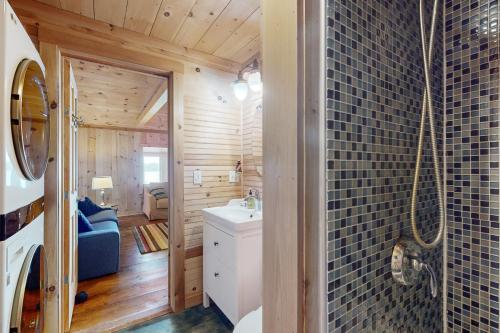 a bathroom with a toilet and a sink in a room at Sunflower Cottage in Freeport