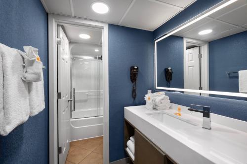 a bathroom with a sink and a mirror at Captain's Quarters Resort in Myrtle Beach
