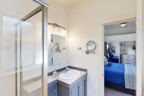 a bathroom with a sink and a mirror at Jewel by the Sea in Cambria