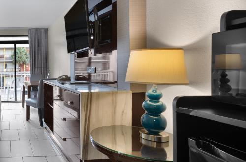 a kitchen with a table with a lamp on it at Captain's Quarters Resort in Myrtle Beach