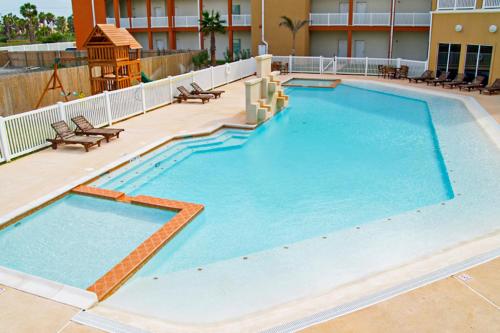 a large swimming pool on top of a building at La Isla Condominiums #C105 in South Padre Island