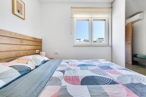 Ένα ή περισσότερα κρεβάτια σε δωμάτιο στο Sea Bay View apartment - Appartement avec piscine et magnifique vue sur mer
