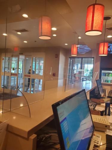 an office with a table with a laptop on it at Country Inn & Suites by Radisson, Rocky Mount, NC in Rocky Mount