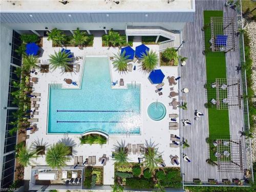 an overhead view of a pool at a resort at Luxe Waterfront Penthouse in Fort Myers
