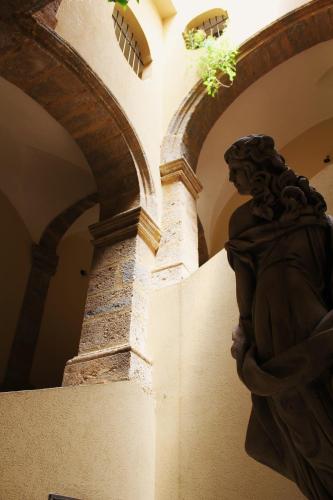 a statue of a woman in a building at Casa P&G in Niscemi
