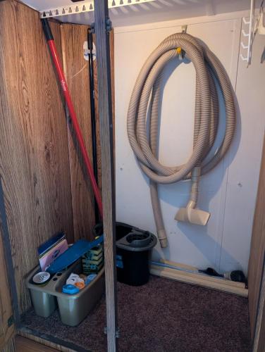 a group of hoses in a room with a mirror at Stay RV Redcliff in Redcliff