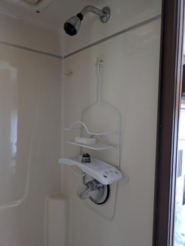 a bathroom with a sink and a shower at Stay RV Redcliff in Redcliff