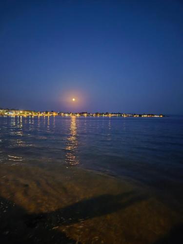 a view of the ocean at night at Black Rock Agria in Agria