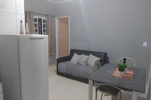a living room with a couch and a table at Apto 11 bom preço benefício in Brasilia
