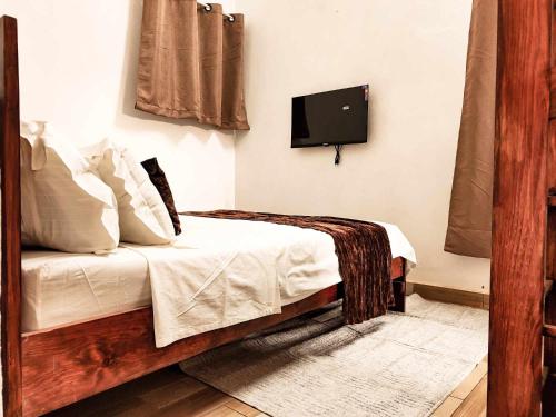 Postel nebo postele na pokoji v ubytování M'Serenity Guest House