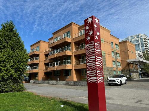 a red and white pole in front of a building at SureStay by Best Western Richmond Vancouver Airport in Richmond