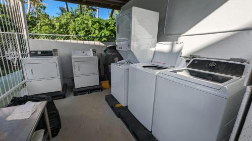 a laundry room with a washer and dryer at Ocean Villa Guam in Tamuning