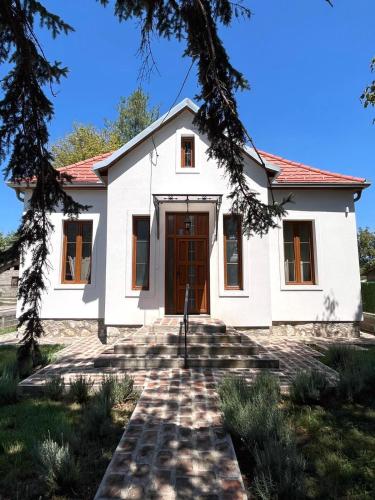 a white house with a red roof at Bela Vila in Banja Koviljača