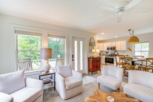 a living room with white furniture and a kitchen at Less Than 6 Mi to Nags Head Manteo Beach House in Manteo
