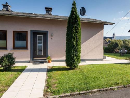a house with a tree in front of it at Holiday home Moselle valley in Maring-Noviand