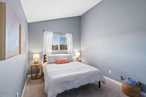 a small bedroom with a bed with a window at Beautiful Mountain Views Close to Hiking Trails in Monument