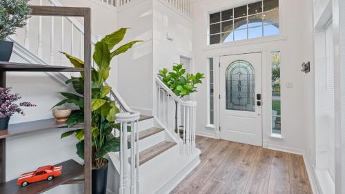 a home with white walls and a staircase with a toy car at Serene Escape by the Lake home in Montgomery