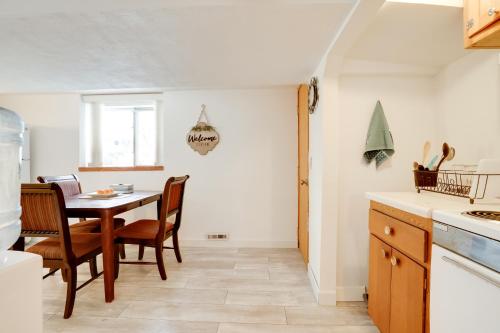a kitchen with a table and chairs in a room at Pet-Friendly Minneapolis Apt Near Shops and Dining! in Minneapolis