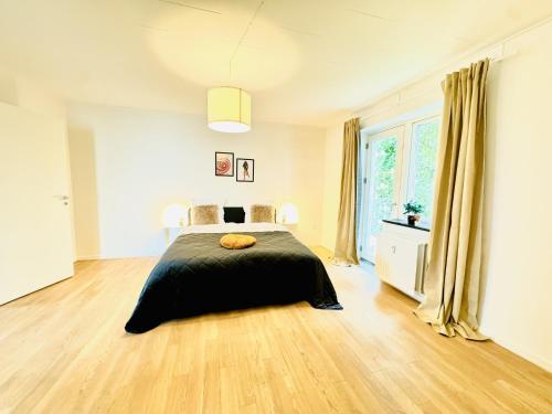 Postel nebo postele na pokoji v ubytování aday - Solsortvej Suite 3 Randers