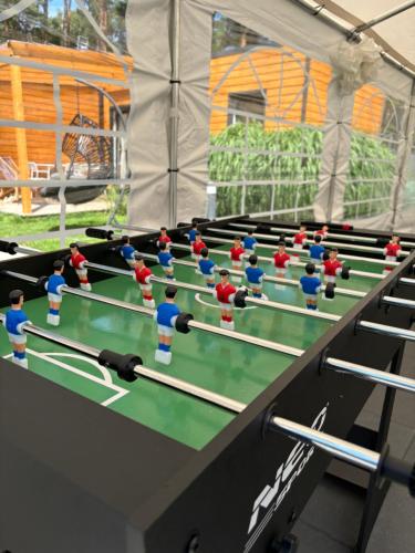 a group of toy people playing table tennis at Seaside Harmony in Pogorzelica