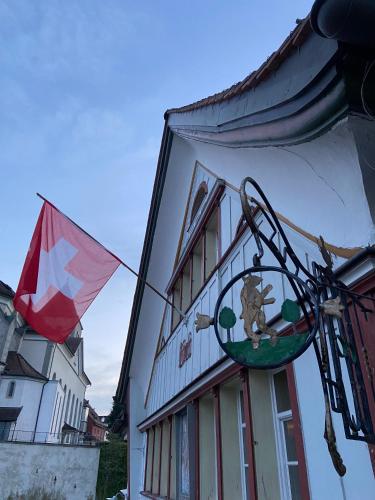 a kite is hanging on the side of a building at Ferienwohnung Bärli Appenzell in Appenzell