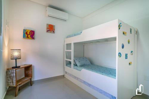 Ένα ή περισσότερα κρεβάτια σε δωμάτιο στο Apartamento 02 dormitórios