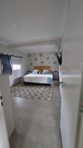 a bedroom with a bed in a room at La beethoven YB in Yerba Buena