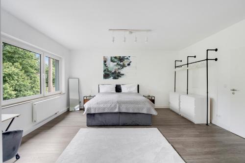 Ένα ή περισσότερα κρεβάτια σε δωμάτιο στο Design Apartment - Traumlage zwischen CGN & DUS