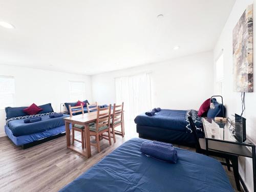 a living room with a couch and a table at Cozy 3 BR Townhouse with Balcony in Los Angeles