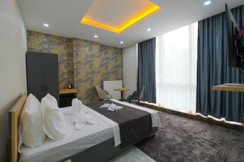 Postel nebo postele na pokoji v ubytování Minimalist Suit Otel