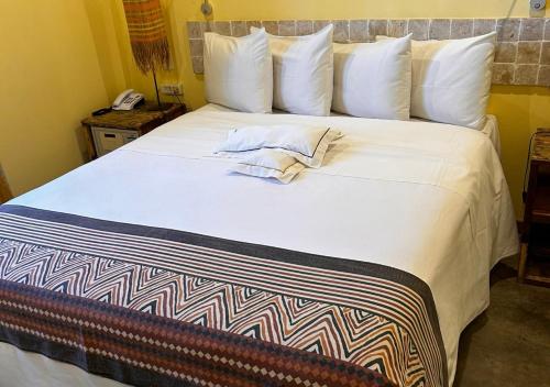 Postel nebo postele na pokoji v ubytování Bahiacafé Hotel