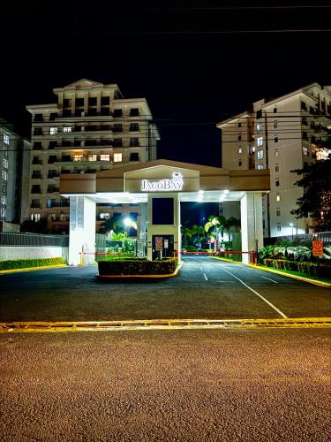 a mobil gas station at night in a city at Luxury Condo at Jaco Bay, Costa Rica's best beach in Jacó