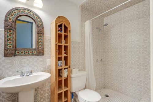 a bathroom with a sink and a toilet and a mirror at Santa Cruz Vacation Rental with Free WiFi in Santa Cruz