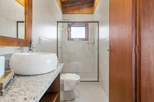 Koupelna v ubytování Cabana Lila Hütte Vila Germânica by Achei