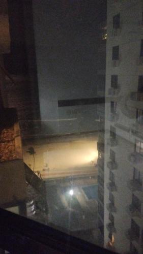 a view from a window of a building at night at Flat Gold Beach in Recife