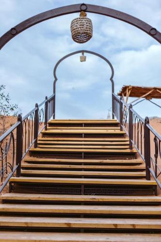 a set of stairs with a chandelier above them at Aman Agafay in Guertsdar