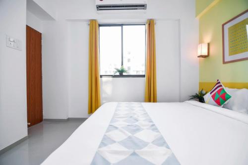 Ένα ή περισσότερα κρεβάτια σε δωμάτιο στο Hotel O Aakiyo Pashan Hill