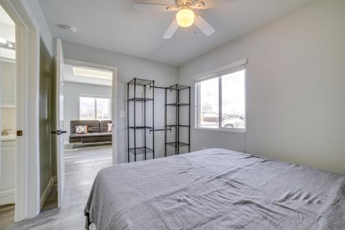 a bedroom with a bed and a ceiling fan at Renovated Hawthorne Apartment By Museums and Dining! in Hawthorne