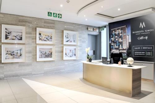 a lobby of a wine store with a reception desk at Masingita Towers Hotel and SPA in Johannesburg