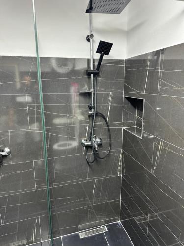 a bathroom with a shower with a bike in it at Tirana Lemon Breeze Hostel in Tirana
