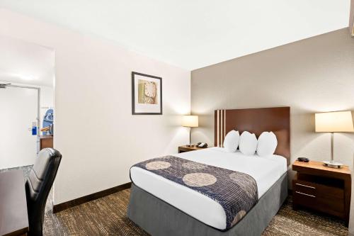 a hotel room with a bed and a desk at Best Western Yacht Harbor Hotel in San Diego