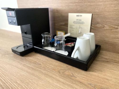 a black box with cups and glasses in it at Park Inn by Radisson Luxembourg City in Luxembourg