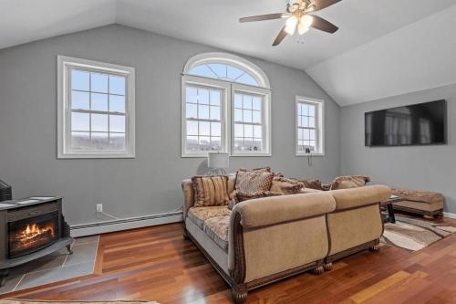 a living room with a couch and a fireplace at Mountain View Suite in Danbury