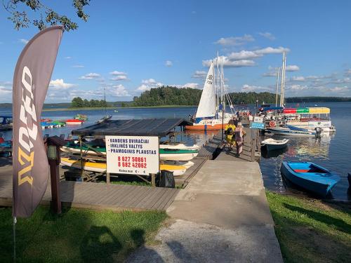 a group of boats are docked at a marina at Artless #2 in Plateliai