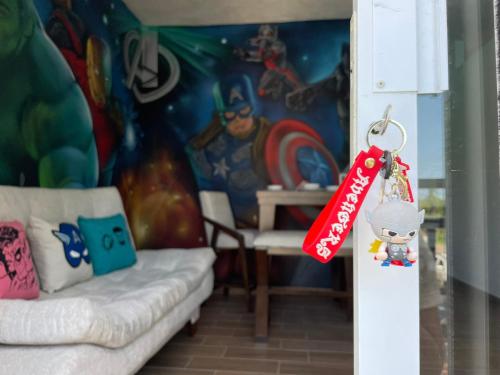 a living room with a key chain and a toy at advengers Bucerias Nayarti in Bucerías