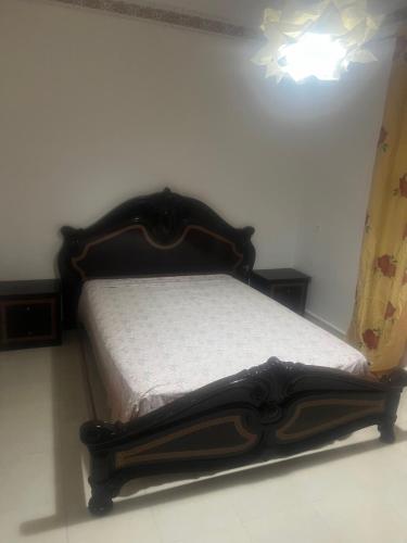 Ένα ή περισσότερα κρεβάτια σε δωμάτιο στο Appart face au grand stade de Tanger