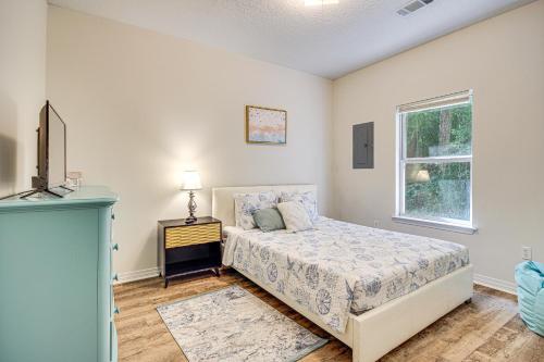 a bedroom with a bed and a window at Peaceful Biloxi Getaway - 7 Mi to Beach and Downtown in Biloxi