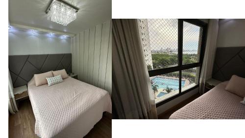 ピサーハスにあるClube Frente Mar | Sauna | Piscina | Beto Carreroのベッドルーム1室(ベッド1台付)、窓(プール付)